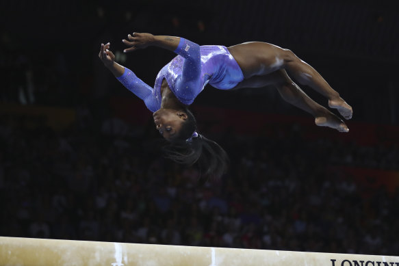 Simone Biles competes in beam final during day 10 of the Gymnastics World Championships in Stuttgart on Sunday.