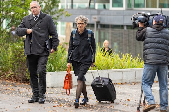 Homicide Detective Acting Sergeant Stephen Eppingstall and prosecutor Nanette Rogers arrive at the Latrobe Valley Magistrates’ Court in Morwell, Victoria, on Wednesday.