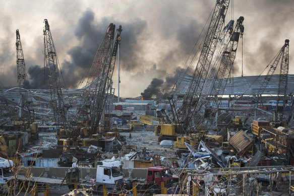 Smoke rises in the aftermath of a massive explosion in Beirut.