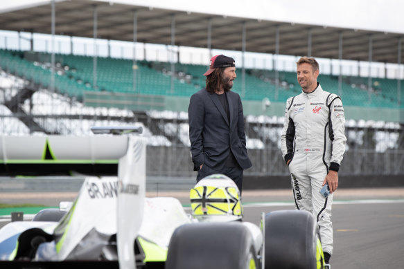 Keanu Reeves and Jenson Button in Brawn: Reeves’ presence changes the documentary formula.