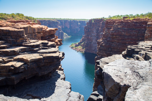 Float between the rust-tinged cliffs of King George River.