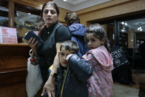 Ethnic Armenians from Nagorno-Karabakh to Armenia wait to be checked into a hotel in Goris, Armenia. 