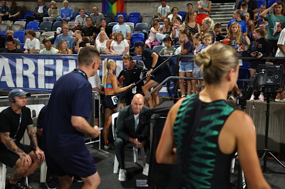 Jessica Hull talks to her coach and father Simon Hull after the 1500m fall as Claudia Hollingsworth of Victoria walks past.