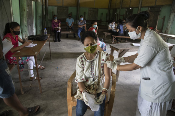 A woman is injected with a dose of the Covaxin COVID vaccine in Assam, India earlier this year.