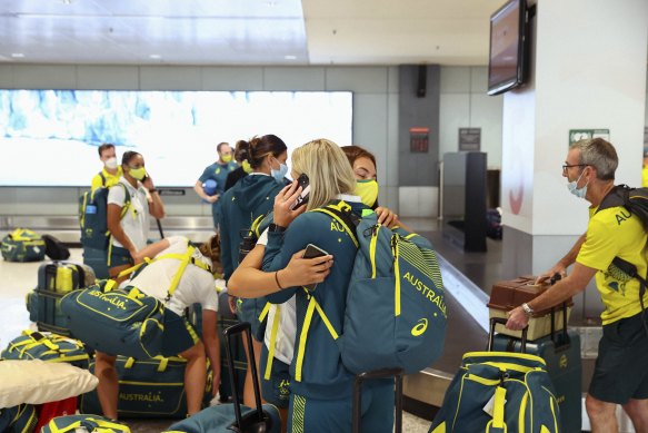 Members of the Australian Olympic team arrive at Sydney Airport.