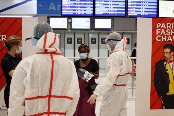 A passenger is tested upon arrival at Roissy Charles de Gaulle airport in Paris. Travellers entering France from 16 countries where the coronavirus is circulating widely are having to undergo tests upon arrival at French airports. Even so, France has just been added to a quarantine list for Norway.
