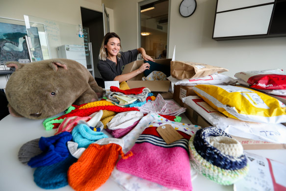 Jenn Rhodes from WIRES with crafted wildlife pouches that have been donated.