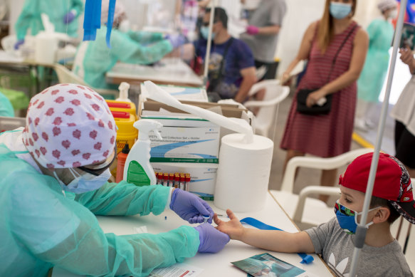 A child gets tested for COVID-19 in Torrejon de Ardoz, Spain.