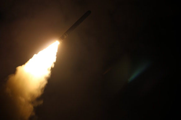 In this image from 2018 provided by the US Navy, the guided-missile cruiser USS Monterey (CG 61) fires a Tomahawk land attack missile.