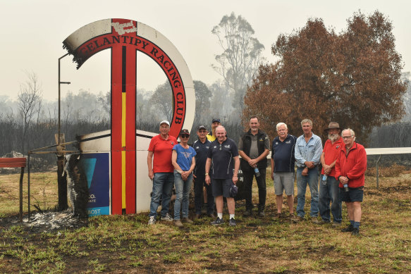 Ian Dunkley (far left) is a veteran country racing official who has been working hard to get the Buchan track back in shape after fires devastated the area.
