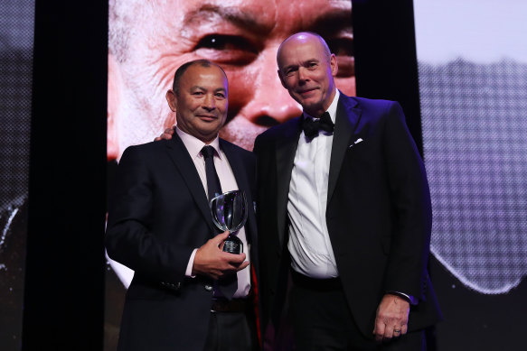 In happier times ... Eddie Jones received the World Rugby Coach of the Year Award in 2016 from Sir Clive Woodward.