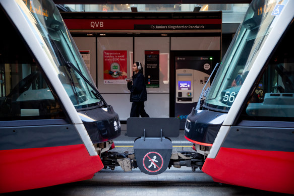 Signage between carriages on the light rail.