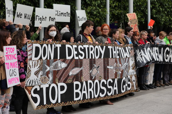 Protesters gather at the front of the Federal Court in Melbourne during the Santos appeal.