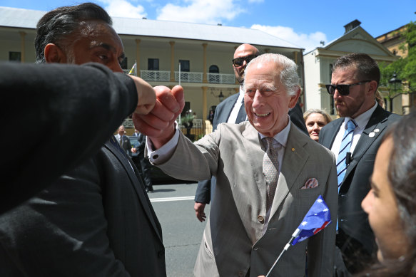 King Charles greets fans outside parliament. 