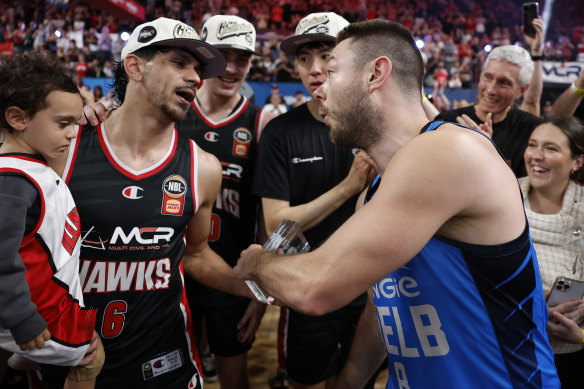 Matthew Dellavedova hands over his Finals MVP award to William Hickey.