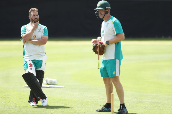 Aaron Finch talks to interim head coach Andrew McDonald during an Australian training session at the Sydney Cricket Ground.