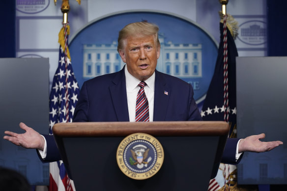 President Donald Trump gestures at a news conference at the White House, on Sunday.