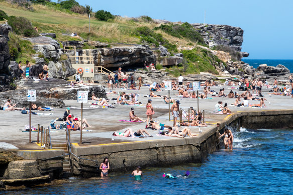 Sydneysiders flocked to Clovelly Beach to enjoy the warm weather on Monday.