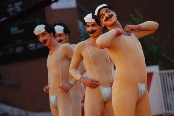 Performers impersonating Borat arrive on the red carpet at the Rome Film Festival on Friday.