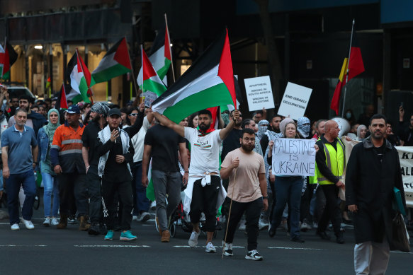 Protesters march for Palestine in Sydney on Monday.