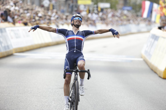 Frenchman Julian Alaphilippe crosses the line to win his second world road race title.