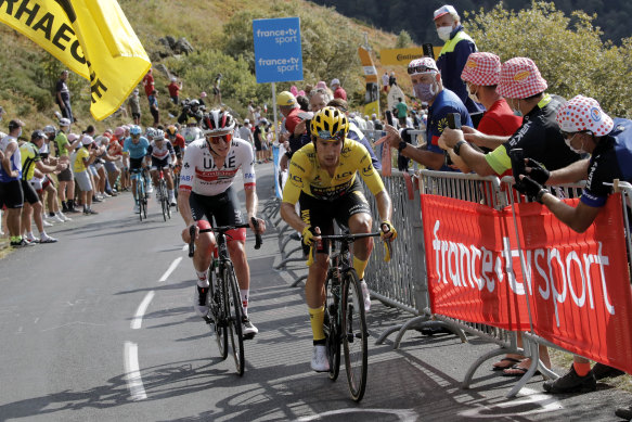 Slovenia's Primoz Roglic, in the leader's yellow jersey, with compatriot Tadej Pogacar on a tough day of climbing.