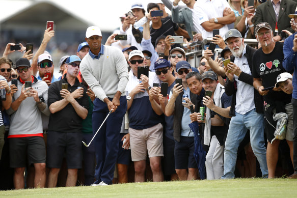 Tiger Woods is watched by a packed gallery at the Presidents Cup on Friday.