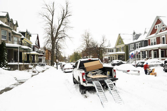 Residents of Buffalo, northern New York state, have been hit with a dangerous lake-effect snowstorm that had dropped nearly 1.8m of snow in some areas and caused three deaths.