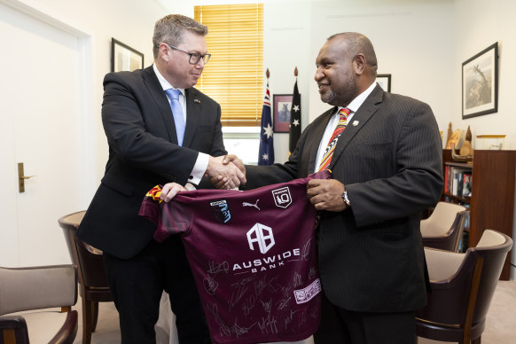 Rugby league diplomacy: Pacific Minister Pat Conroy presents PNG Prime Minister James Marape with a Queensland Maroons jersey in Canberra earlier this year..