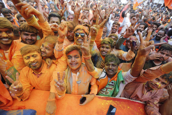 Bharatiya Janata Party (BJP) workers celebrate in Lucknow, India, ahead of election results in March 2022