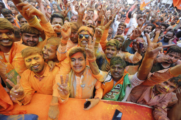 Workers of the Bharatiya Janata Party (BJP) celebrate in Lucknow, India, ahead of the March 2022 election results.