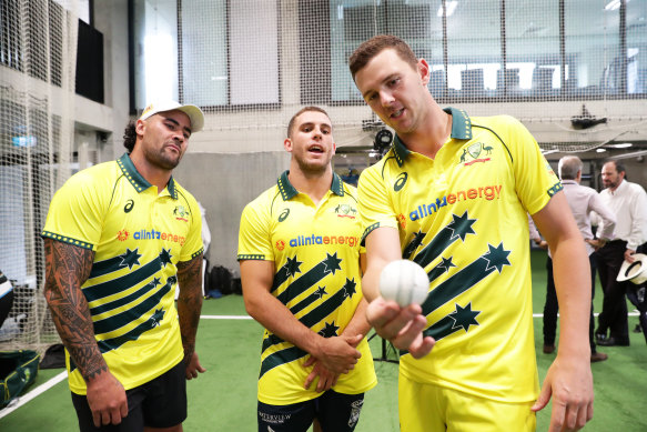 Josh Hazlewood (right), gives some pointers to NRL duo Andrew Fifita (left) and Adam Elliott in Sydney on Thursday.