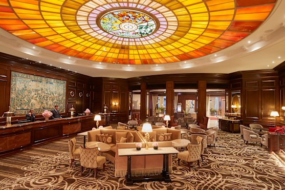 The lobby is crowned with an elaborate stained-glass feature.