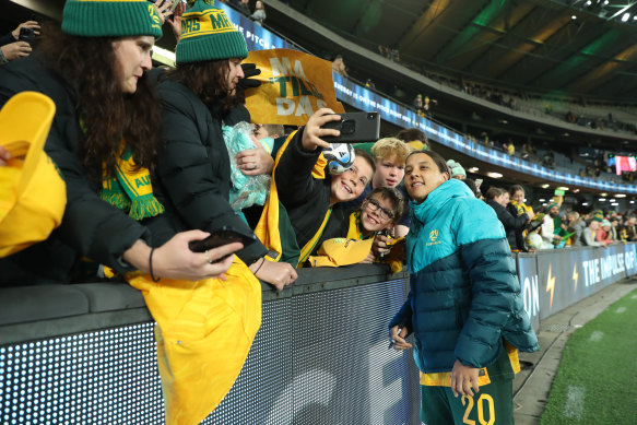 Matildas captain Sam Kerr mingles with soccer fans after the World Cup send-off game against France at Marvel Stadium last week.