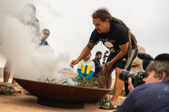 Robert Kelly conducts a smoking ceremony as Environment Minister Sussan Ley made the burial announcement.