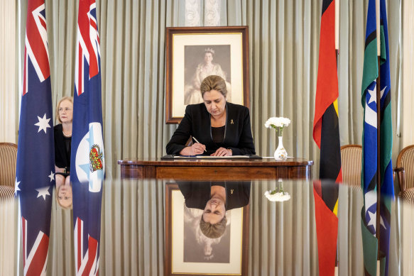 Queensland Premier Annastacia Palaszczuk signing the Queen’s condolence book. 