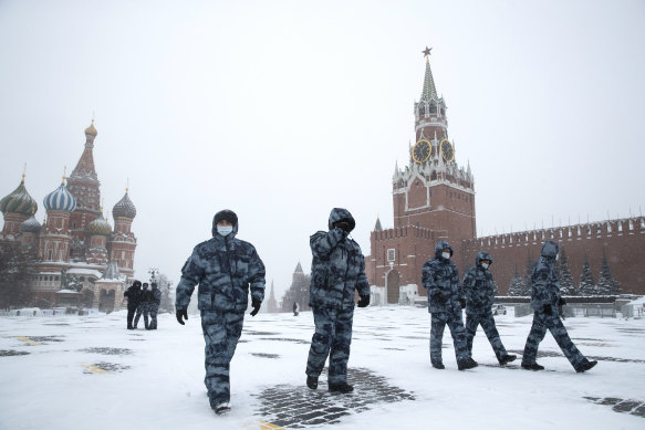 Russian riot police officers walk in Red square  on Friday February 12, 2021. 
