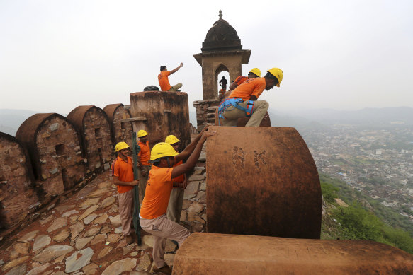 State Disaster Response personnel perform a search operation at a watchtower of the 12th century Amber Fort where 11 people were killed after being struck by lightning in Jaipur, Rajasthan state, India.