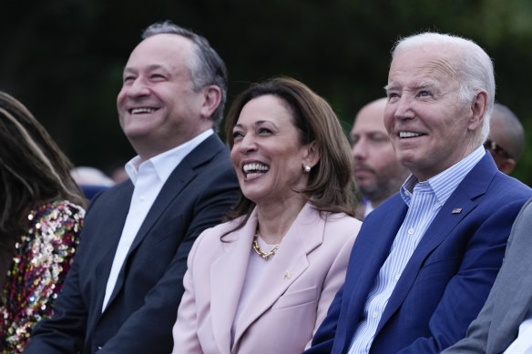 President Joe Biden listens with Vice President Kamala Harris and second gentleman Doug Emhoff during a Juneteenth concert on the South Lawn of the White House in Washington, Monday, June 10, 2024. 