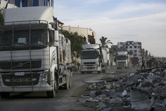 Humanitarian aid trucks enter through the Kerem Shalom crossing from Egypt into the Gaza Strip on Monday.