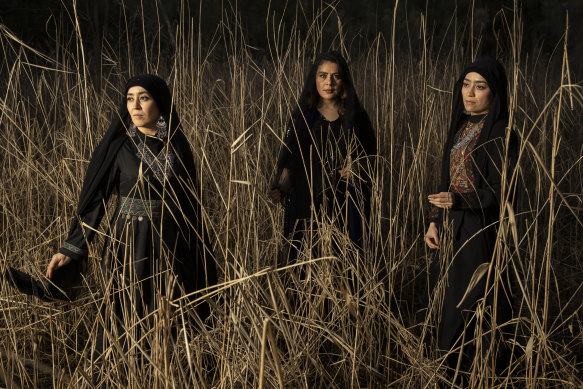 Sisters Narges and Mahboubeh Alizadeh with benefactor and former refugee Saba Vasefi (centre).  