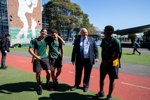 Principal of Granville Boys High, Noel Dixon, with year 10 students Yussef Chaker, Ahmad Amoud and Mamadu Jallah. Dixon has introduced multiple programs and initiatives at the school since 2015.