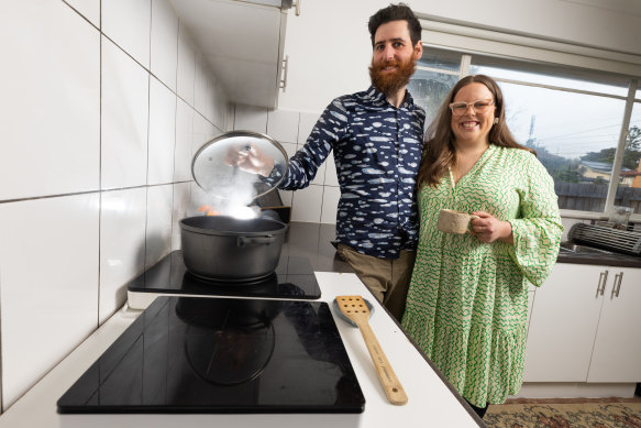 Matt Piper and Steph Rich with their temporary induction cooktops. 