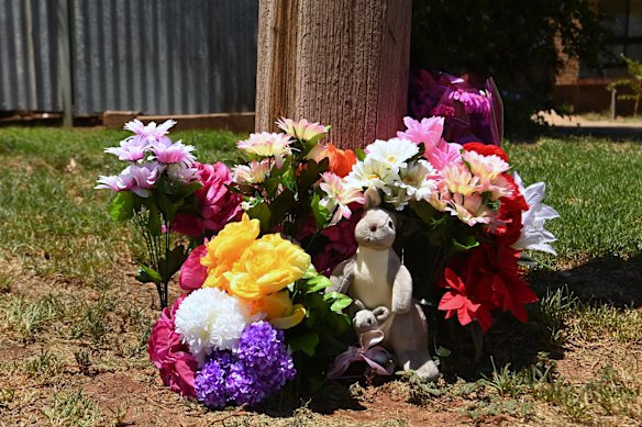 Tributes on Bokhara Street mark the place Sophie Quinn and John Harris were killed.
