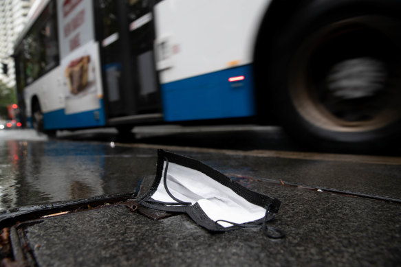 An abandoned face mask lies on Liverpool Street in Sydney. 