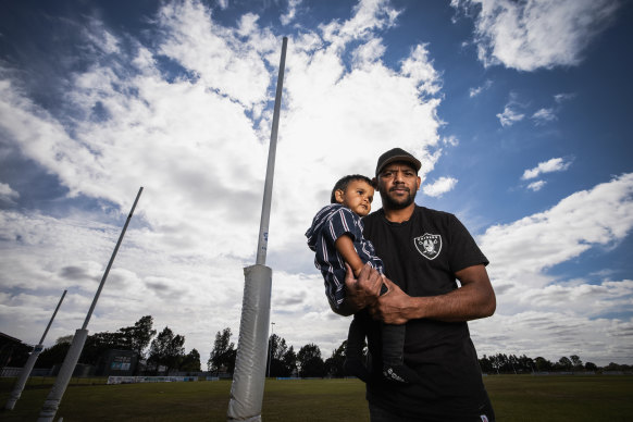 Leon Davis with his one-year-old son Wirin. He wants future generations to not have to suffer from racism.