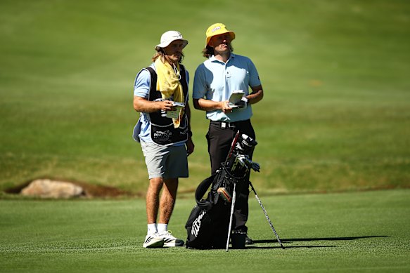 Former Melbourne Storm star Ryan Papenhuyzen working as a caddie for Australian golfer Daniel Gale.