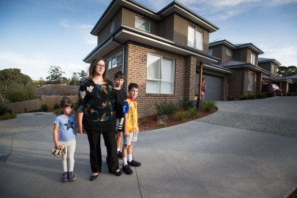 Katie George with her children outside her home on Borlase Street last year.