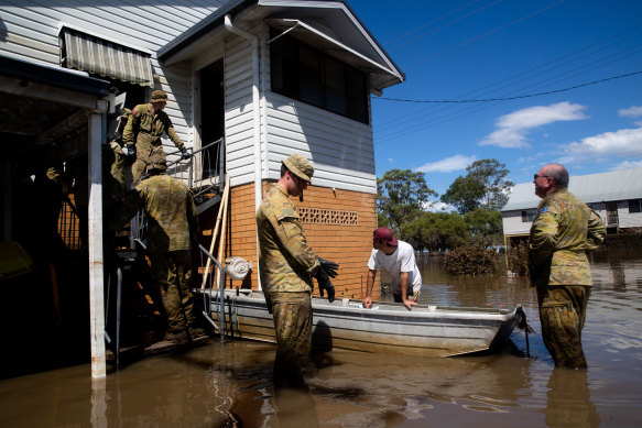 ADF troops joined with local volunteers to help with the clean-up in Woodburn, after the northern NSW flood crisis.