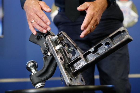 Detective Senior Sergeant Brad McArthur of the major collision investigation unit with the pintle hook.